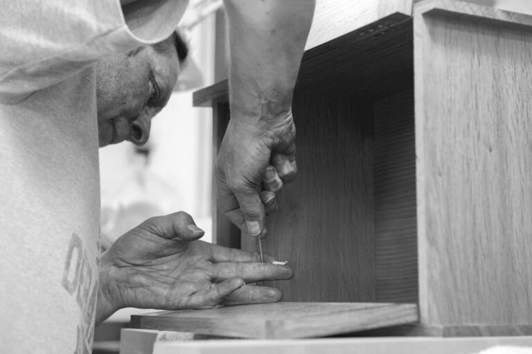 a student attending one of the Rowden woodworking courses, making a cabinet