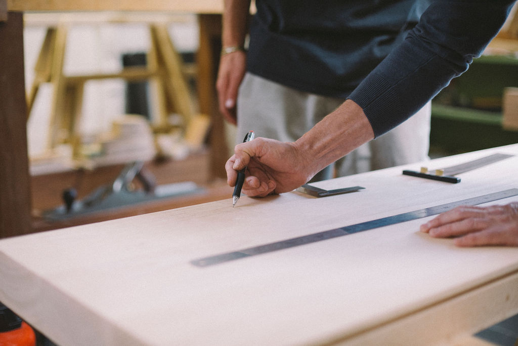 A tutor explaining processes to a student at Rowden Atelier on a cabinetmaking course